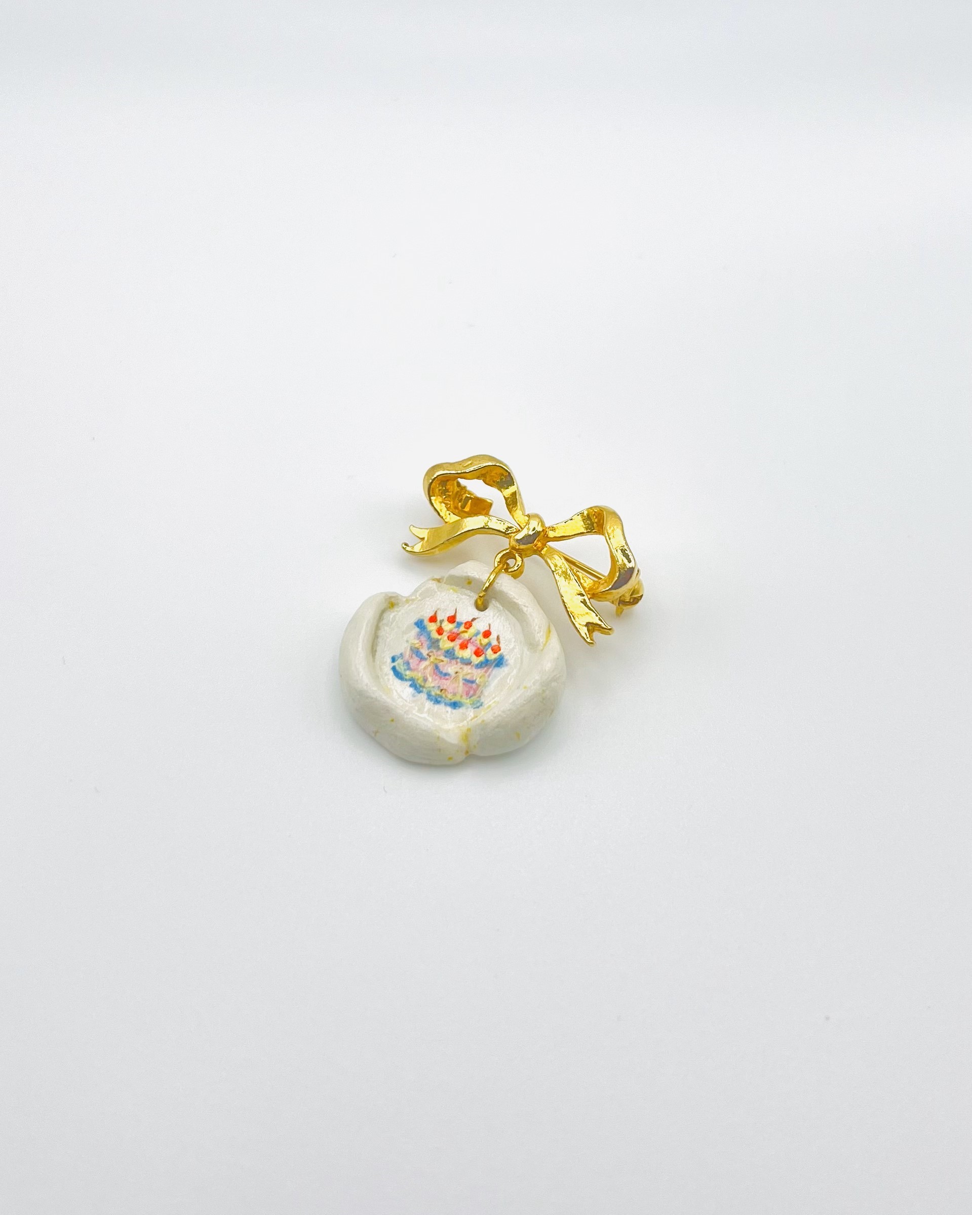 Gold Bow Birthday Cake Charm Brooch - Image 2